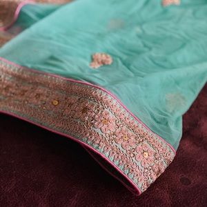 Brand new raw silk Lehenga w/blouse & net veil.